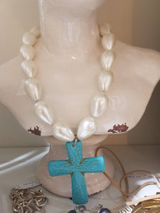 Bear your  turquoise blue cross with pearls